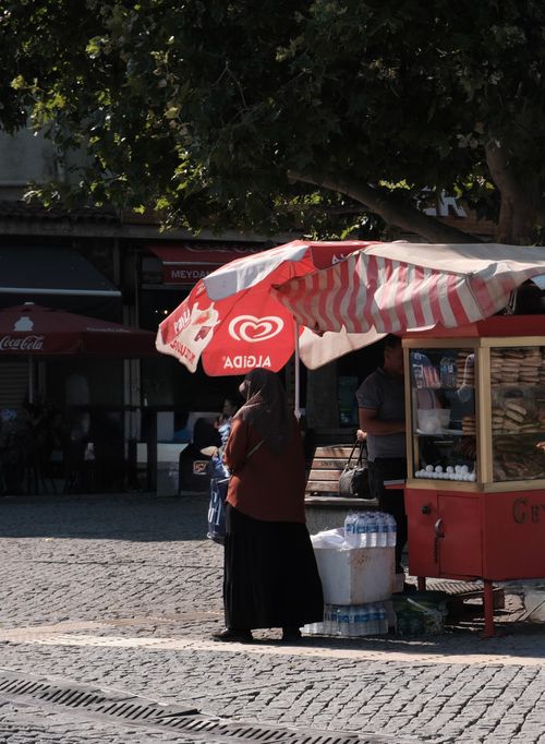 Free Daytime street vendor under umbrella in İzmir, Türkiye, offering local snacks. Stock Photo