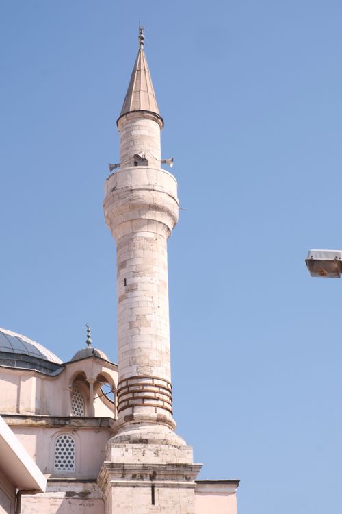 Free A detailed view of a historic minaret in İzmir, Türkiye, set against a clear blue sky. Stock Photo