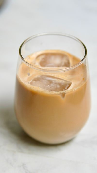 Iced milk coffee in a rounded glass — photo by Koushalya Karthikeyan on Pexels