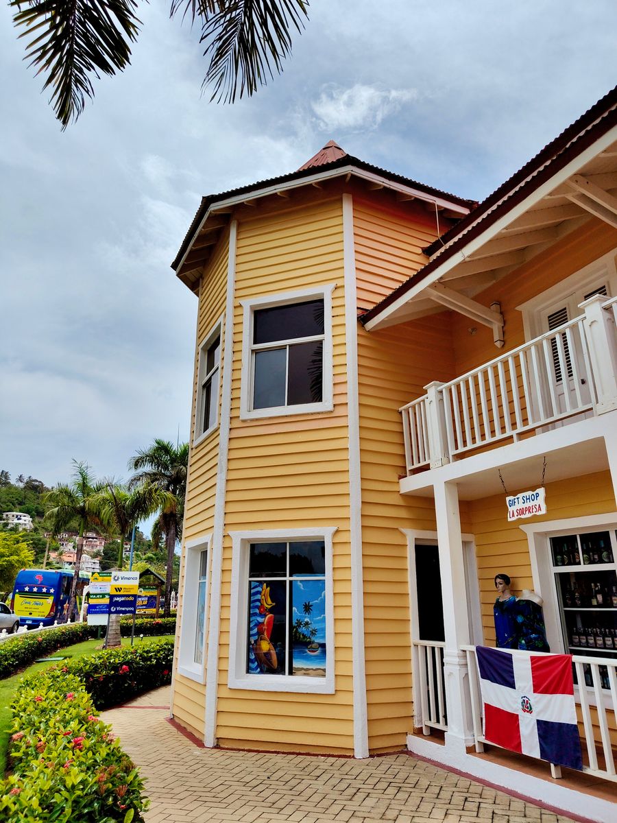 Bright Caribbean storefront with a Dominican flag in Samaná