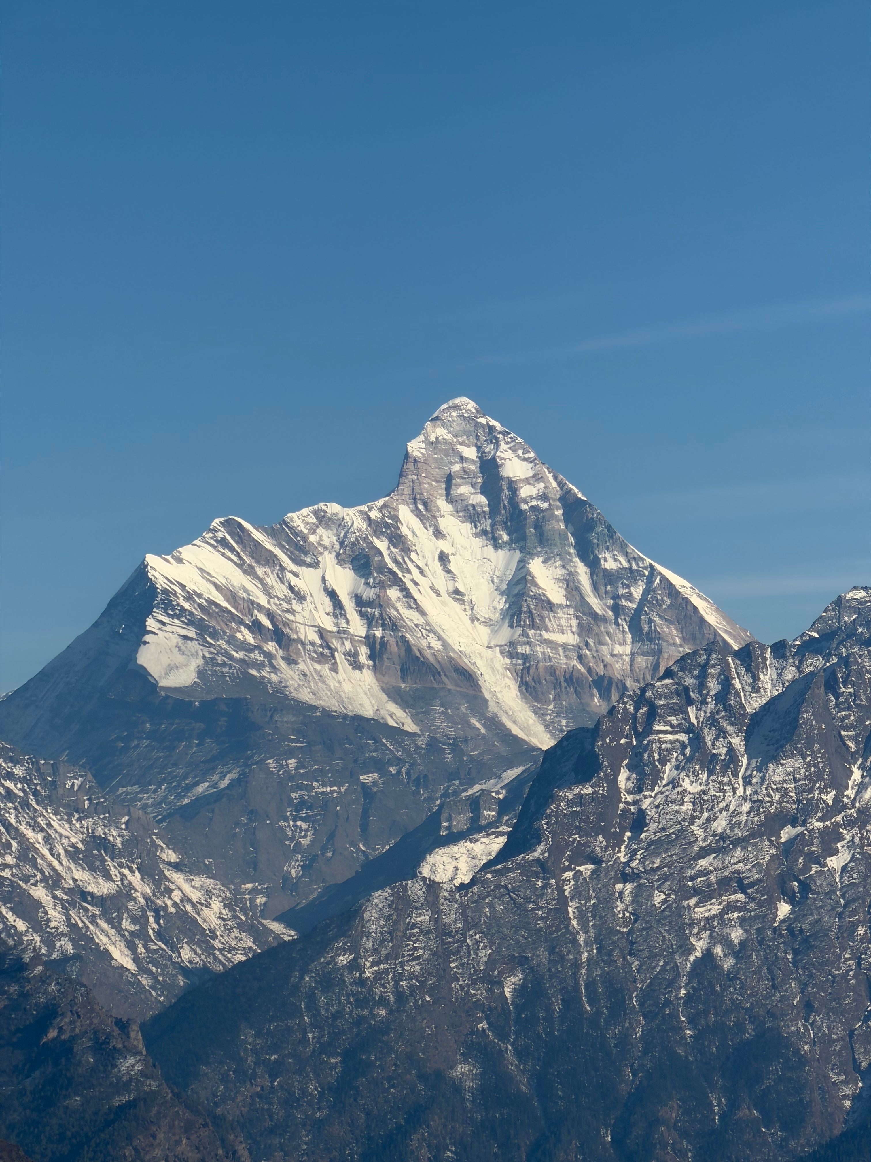 Stunning view of snow-covered Nanda Devi mountain peak in Chamoli, Uttarakhand, India.