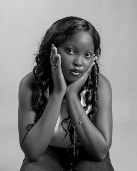 Serene black and white portrait of a young woman with thoughtful expression.