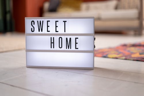 Lit up Sign on Living Room Floor