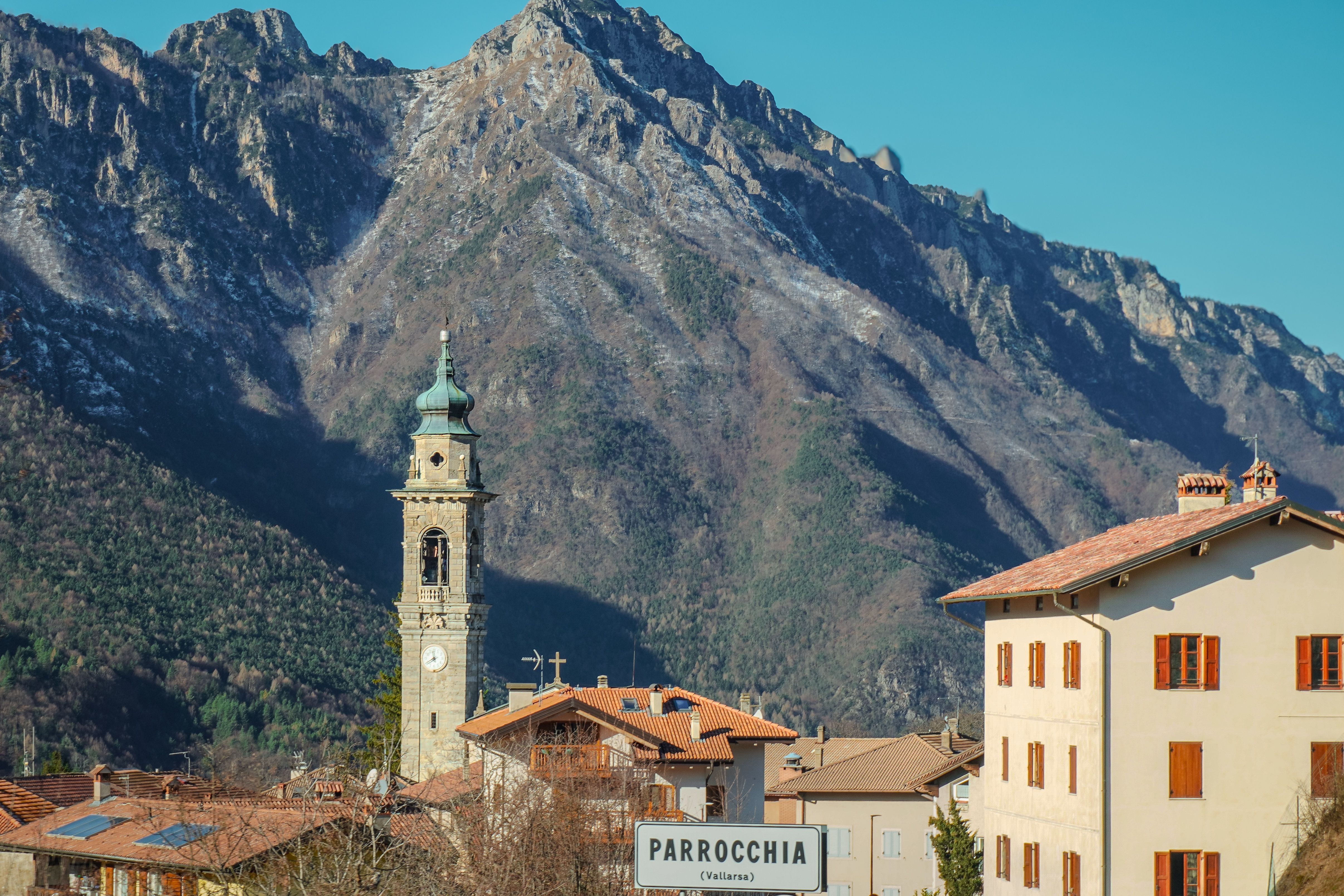 Picturesque view of a quaint village with mountain backdrop in Santorso, Veneto, Italy.