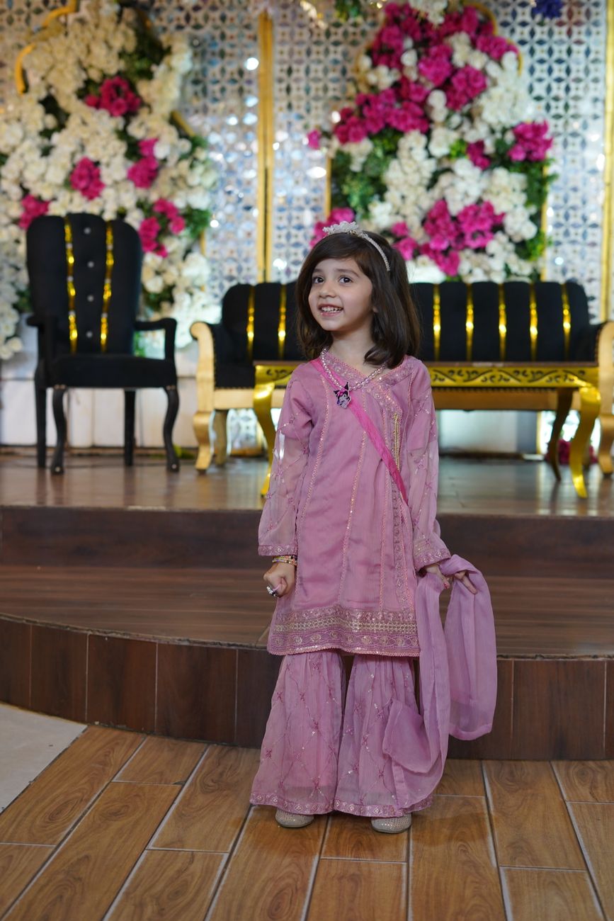 Young Pink Traditional Dress Smiling Indoor Celebration