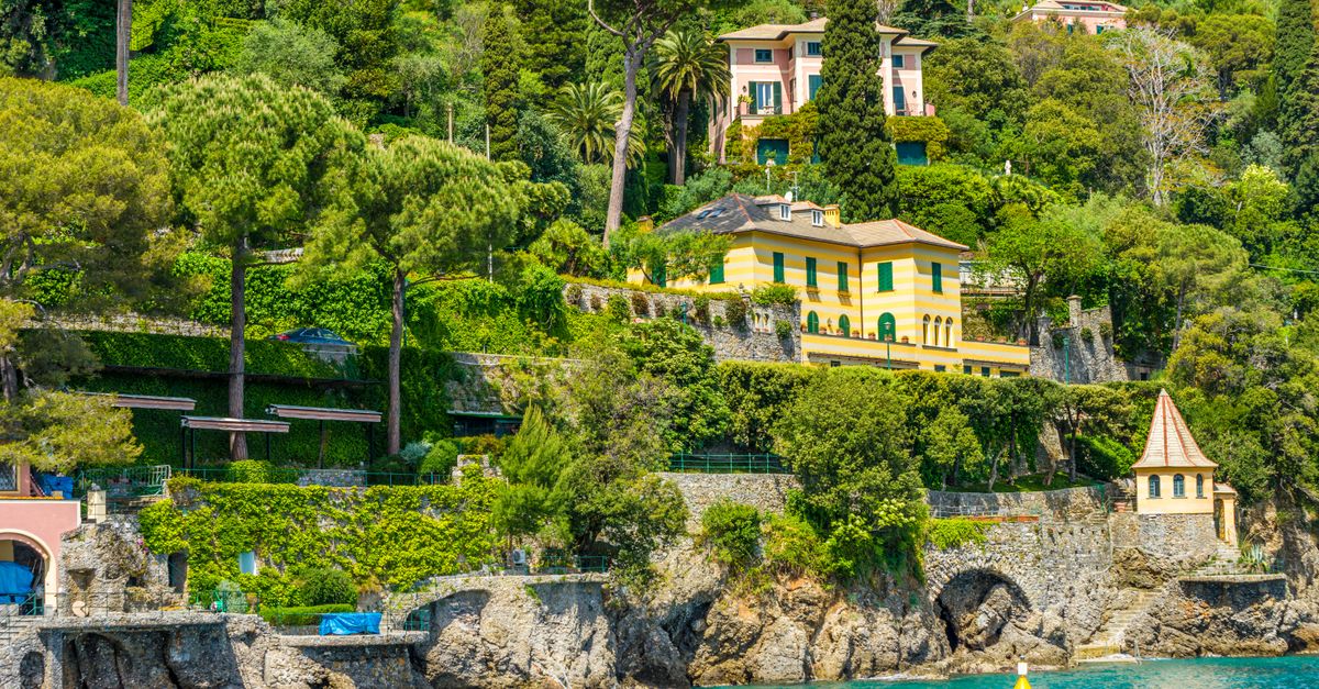 Lush greenery and charming villas along the scenic coast of Portofino, Italy.