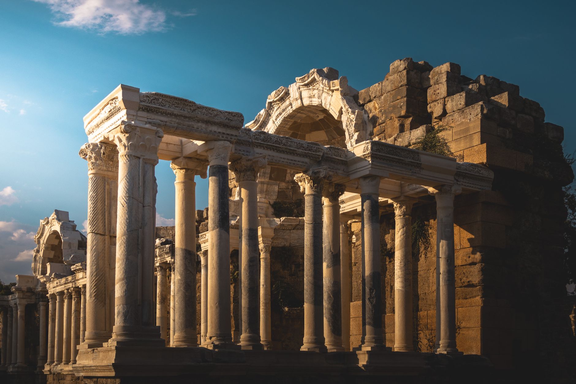 Stunning view of ancient Roman columns under a twilight sky.