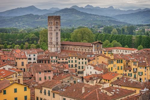 Free A stunning aerial view of the medieval town of Lucca in Italy, showcasing its vibrant rooftops and historic architecture. Stock Photo