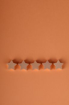 Simple five-star rating on an orange background, showing quality or achievement.