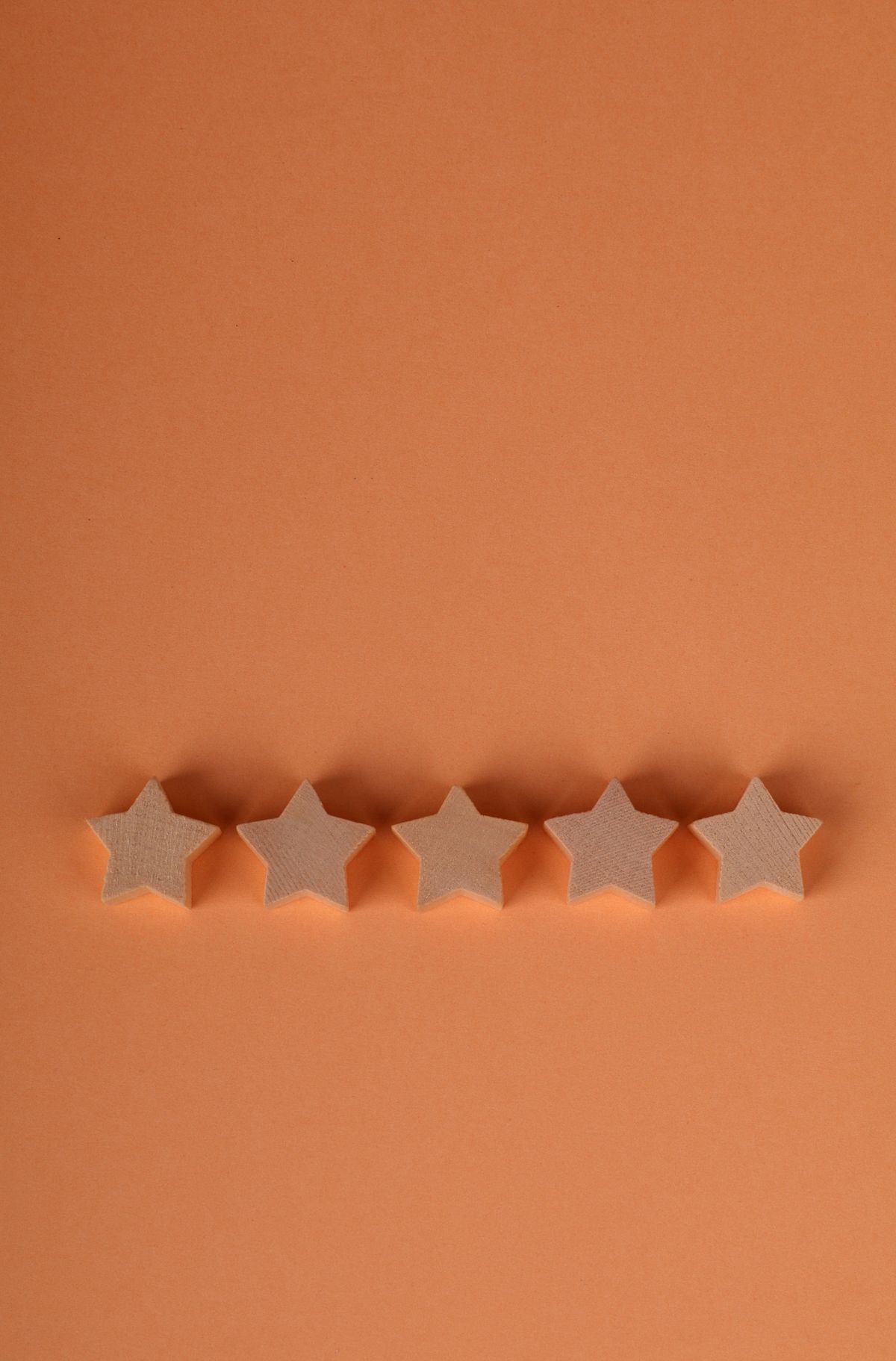 Minimalist five-star rating on an earthy background