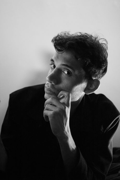 Free A thoughtful black and white portrait of an adult man in a dark jacket. Stock Photo