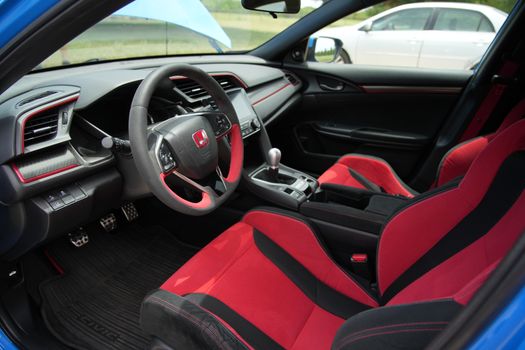 Sleek interior of a Honda Civic Type R at a Wichita Falls car show, highlighting sporty design.