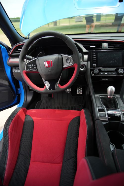 Free Explore the sleek interior of a Honda Civic Type R with sporty red and black accents. Stock Photo