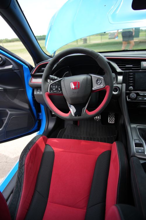 Free Explore the sporty interior of a Honda Civic Type R with vibrant red and sleek black seats. Stock Photo