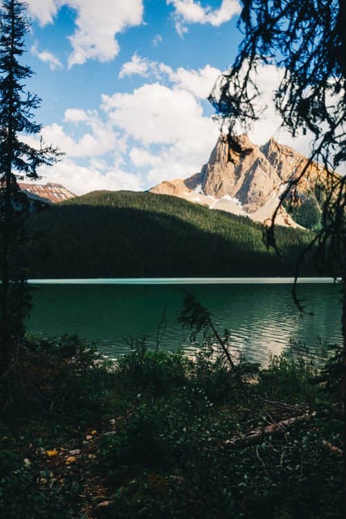 Free Breathtaking view of Emerald Lake with towering mountains in British Columbia, Canada. Stock Photo