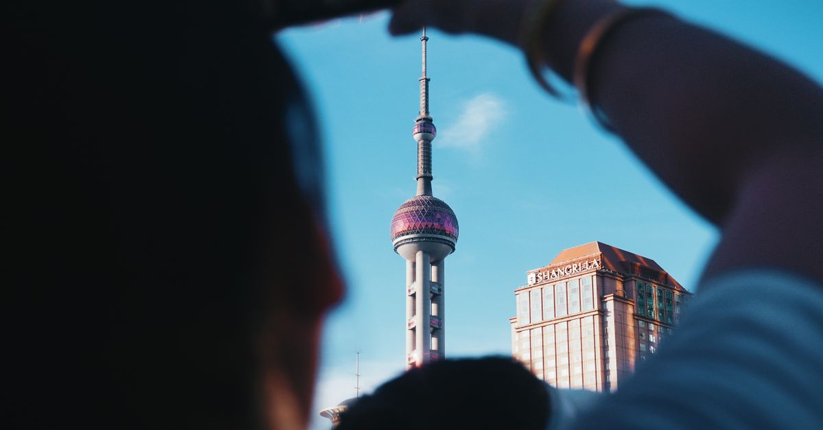 A unique view of the Pearl Tower taken from street level in Shanghai, China.
