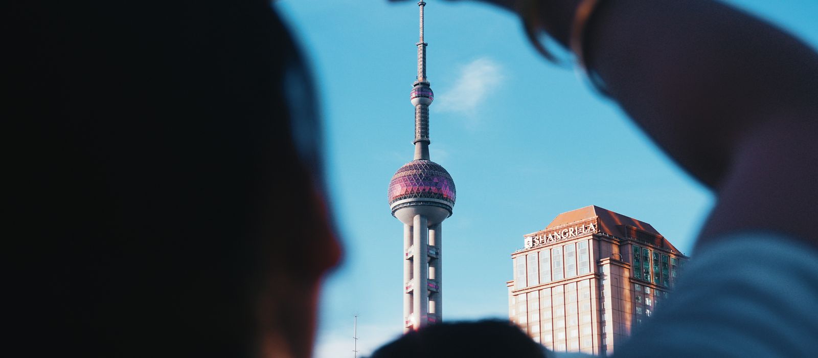A unique view of the Pearl Tower taken from street level in Shanghai, China.