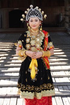 Young woman in traditional Indonesian costume, showcasing cultural heritage in Nusa Tenggara Barat. - Fotografer Sidoarjo