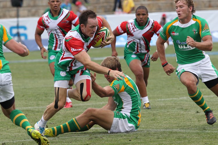 Group Of Men Playing Rugby