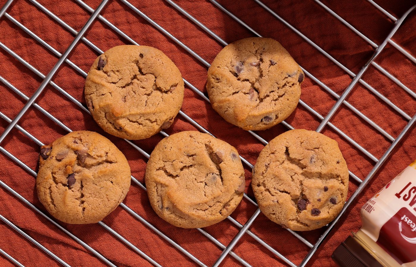 Top view of homemade chocolate chip cookies on a cooling rack.