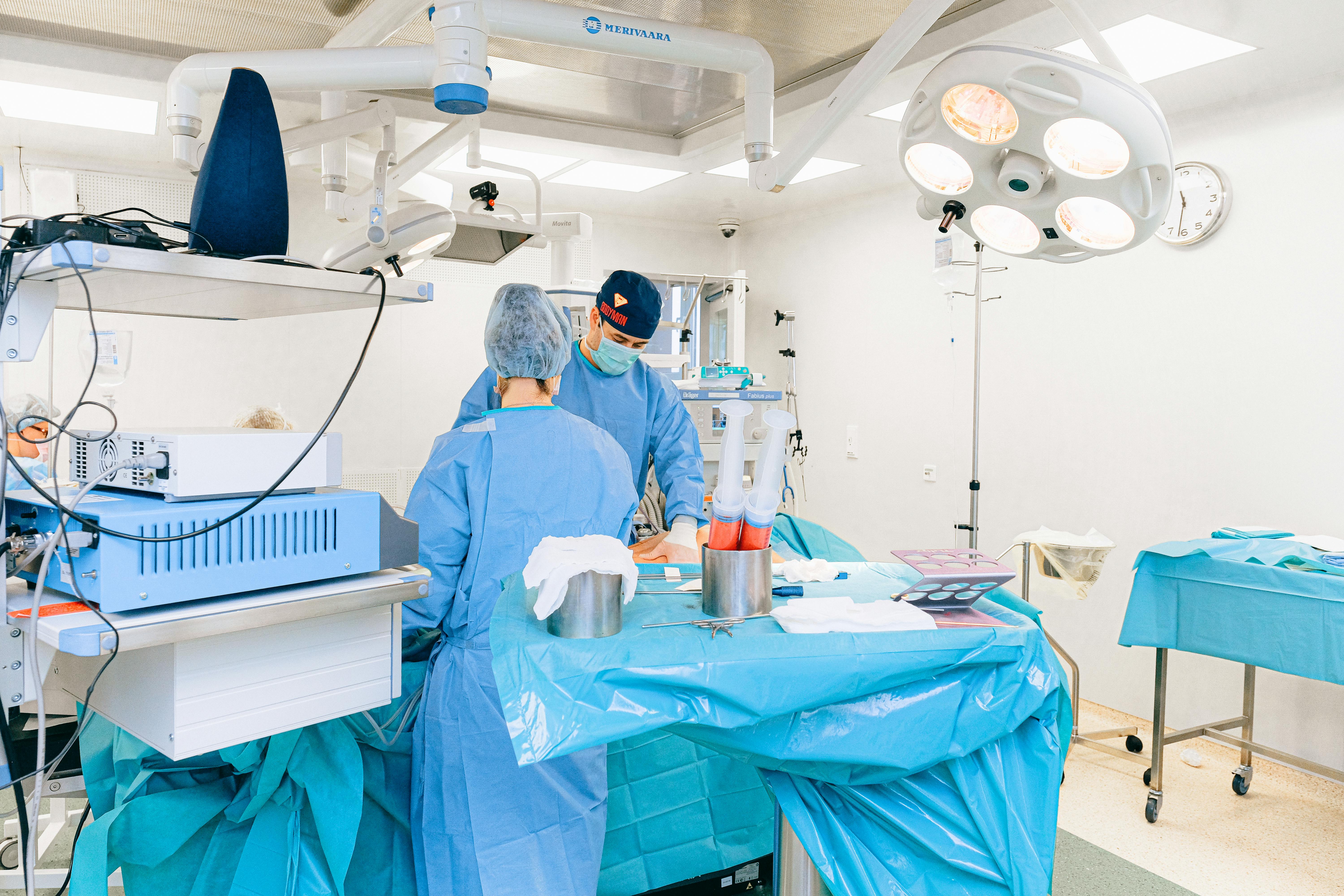Doctor and Nurse Doing a Liposuction