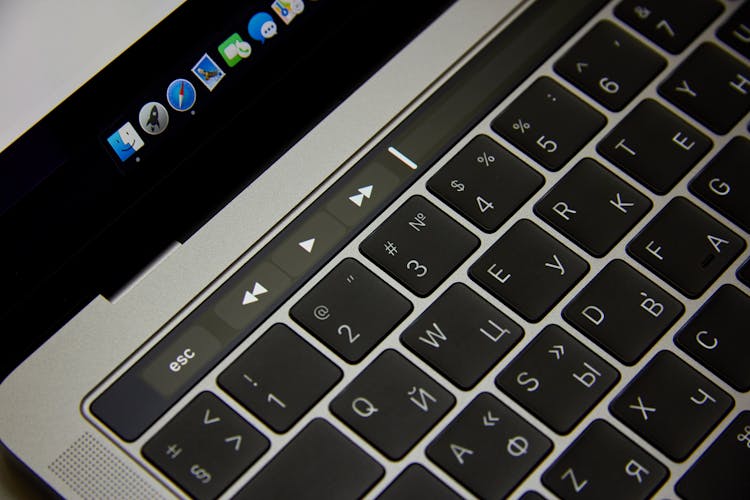 Black Computer Keyboard Buttons With White Signs