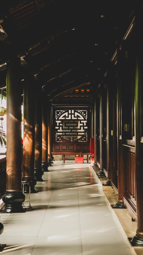 Free Elegant wooden corridor design showcasing Vietnamese architectural style in Ho Chi Minh City. Stock Photo