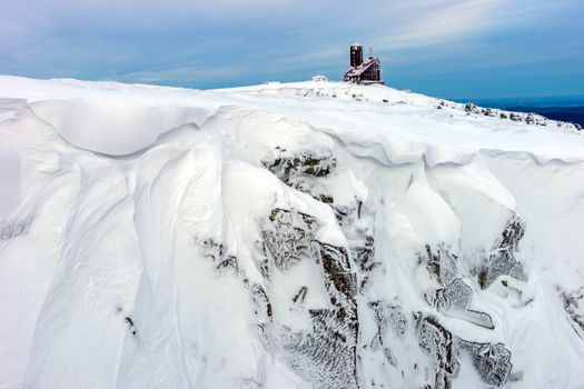 Majestic view of snow-covered Sniezne Kotly in Karkonosze, Poland, showcasing winter beauty.