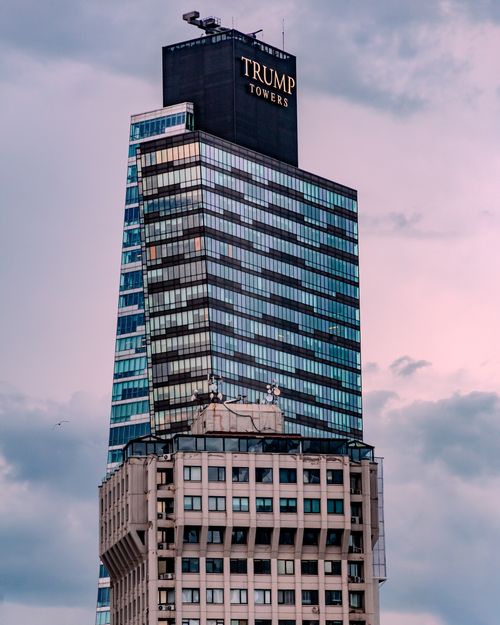 Free A stunning view of the Trump Towers against a cloudy sky, showcasing modern architectural design. Stock Photo
