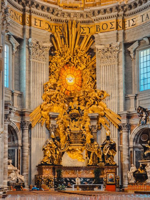 Free Interior view of St. Peter's Basilica showcasing intricate Baroque architecture and golden sculptures. Stock Photo