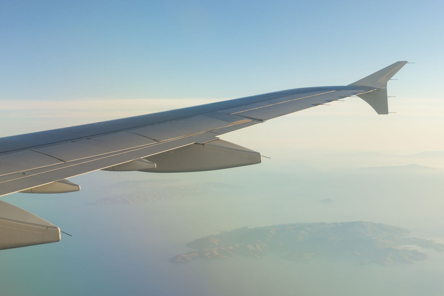 A Hawaiian island seen from an aircraft window on approach