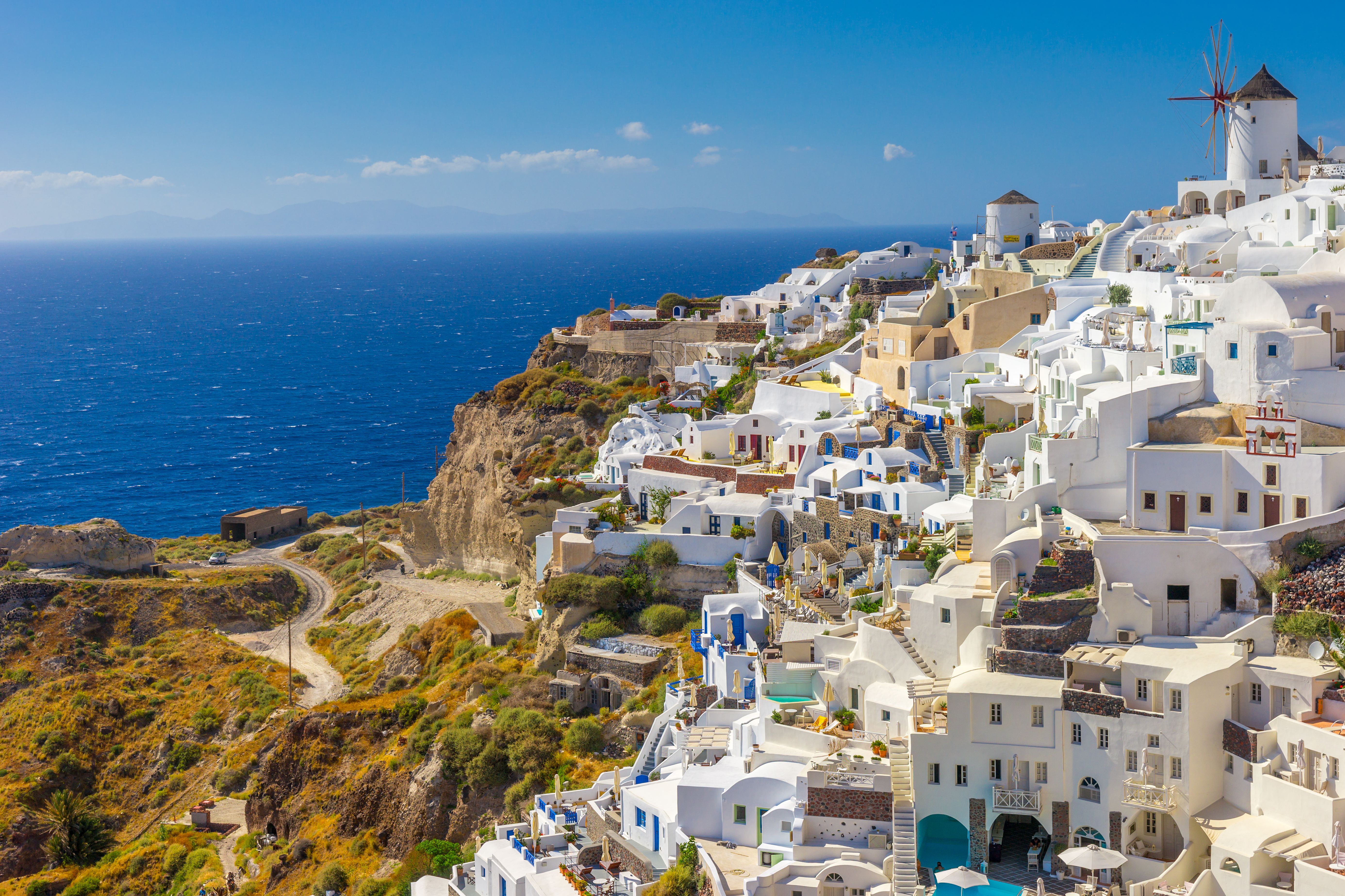 Breathtaking view of Oia, Santorini with whitewashed buildings against the Aegean Sea.