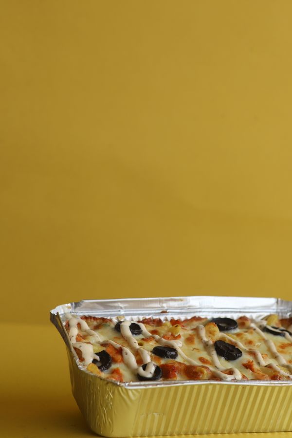 Baked dish served in an aluminium foil container