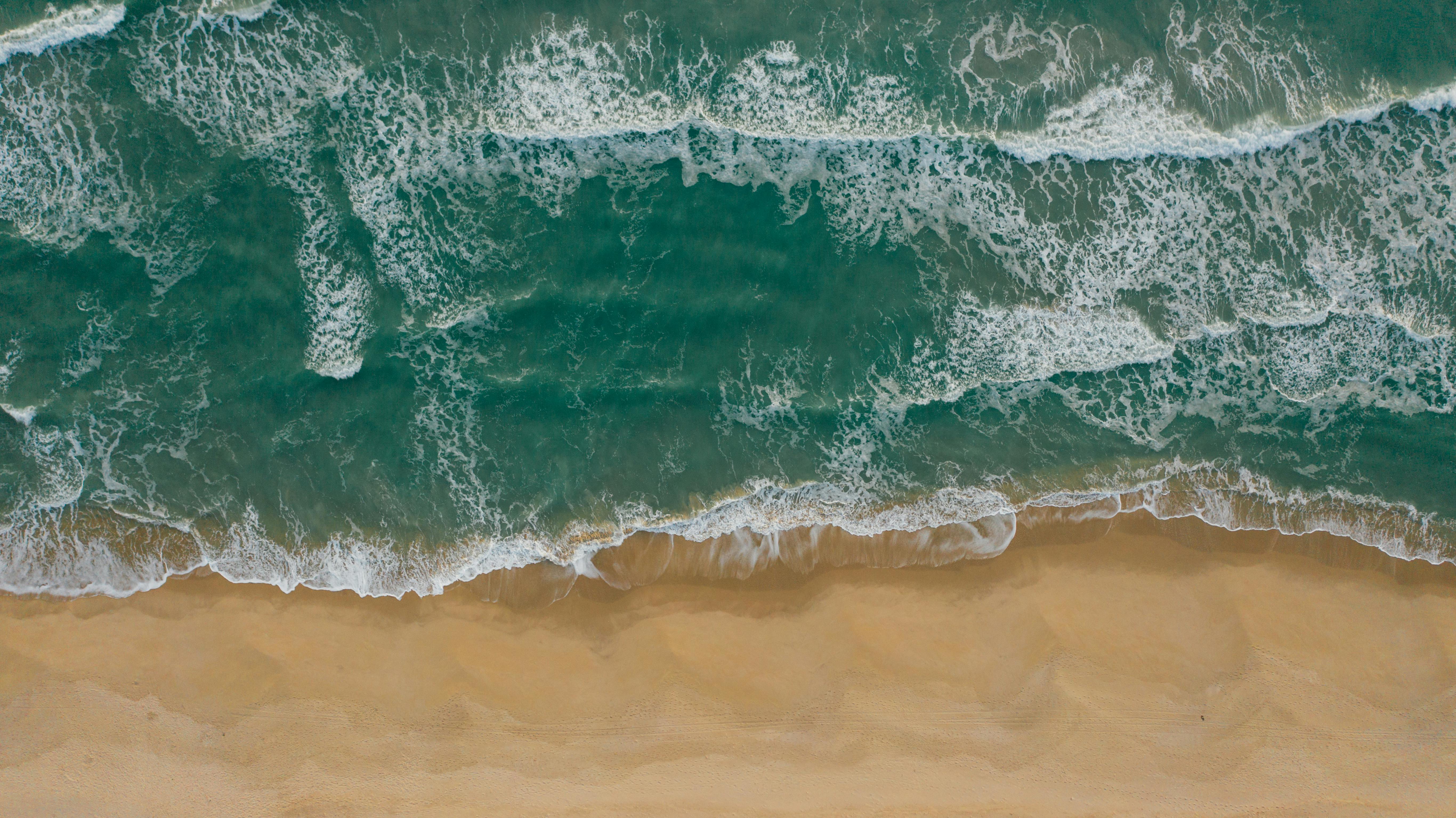 Water Waves on Brown Sand · Free Stock Photo