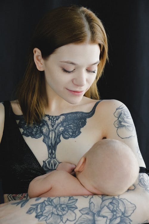 Free Mother Breastfeeding her Child Stock Photo