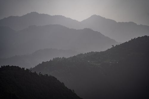Free Serene misty mountain ranges at sunrise in Huehuetenango, Guatemala. Stock Photo