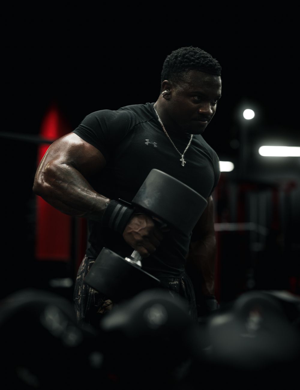 Athlete lifting in the Purity Elite Training Tee