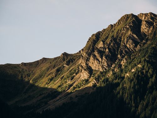 Free Beautiful mountain scene under warm sunset light, capturing natural beauty and wilderness. Stock Photo