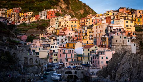 Free Vibrant cliffside houses in Manarola, Cinque Terre, Italy, at sunset. Stock Photo