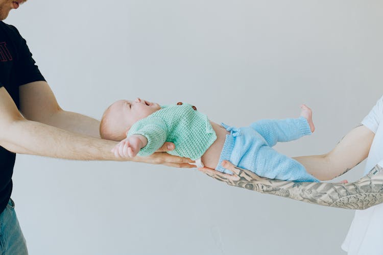 Baby In Green Knitwear