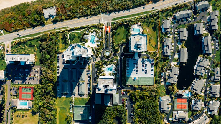 Aerial View Of Residential Buildings Near Road In Small Town