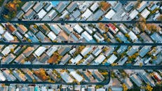 Drone view of residential complex and highways in daylight