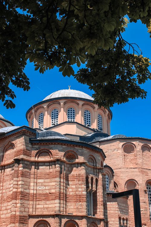 Free A stunning view of a historic Byzantine church with a blue sky background. Stock Photo