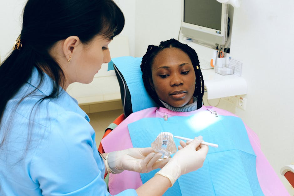 A dental professional showing a patient their 3D digital smile simulation A dental professional showing a patient their 3D digital smile simulation
