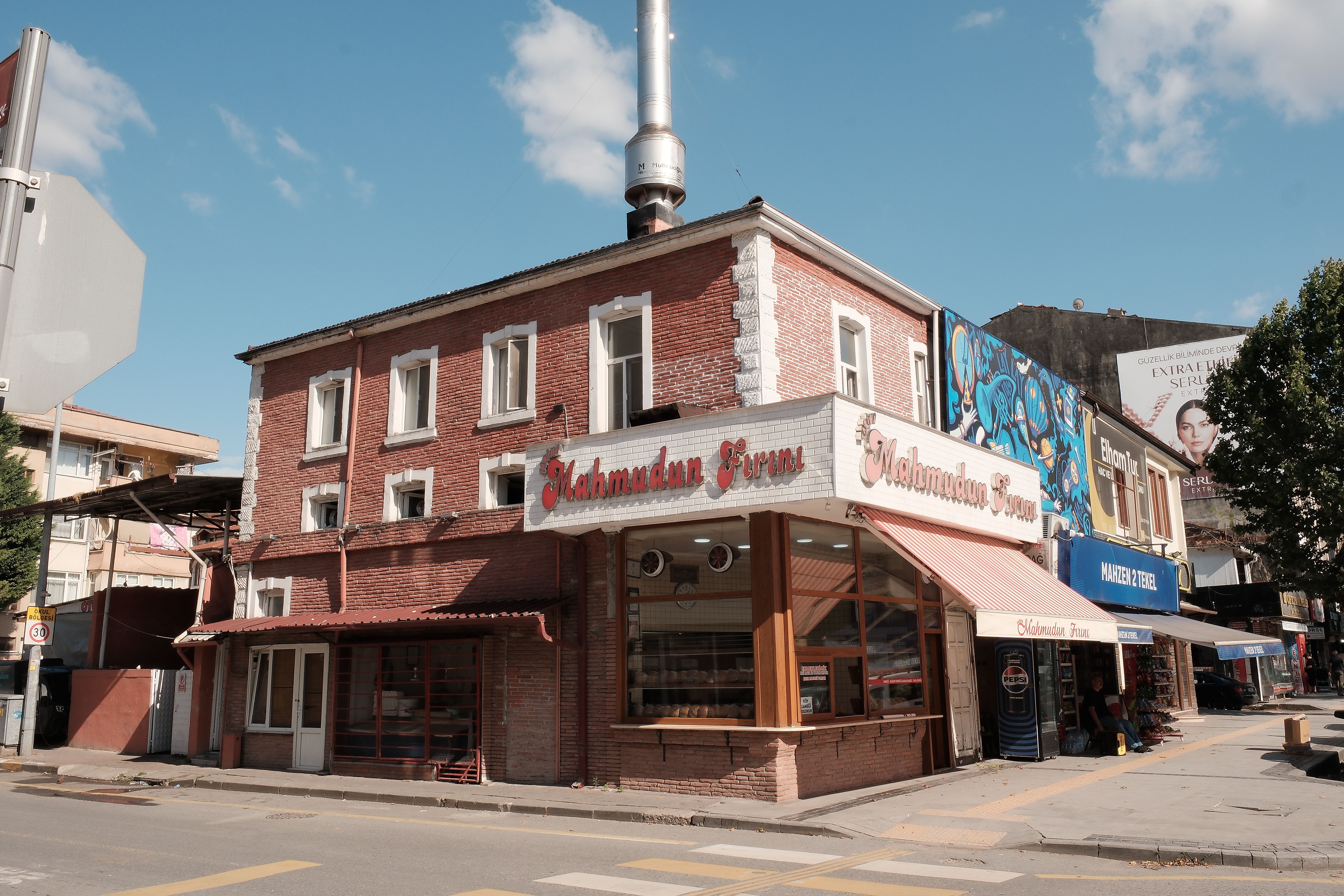 Charming facade of a traditional bakery in Sakarya, Türkiye showcasing vibrant murals and signage.