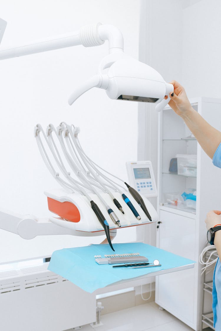 Modern Dental Equipment On Table In Light Room In Clinic