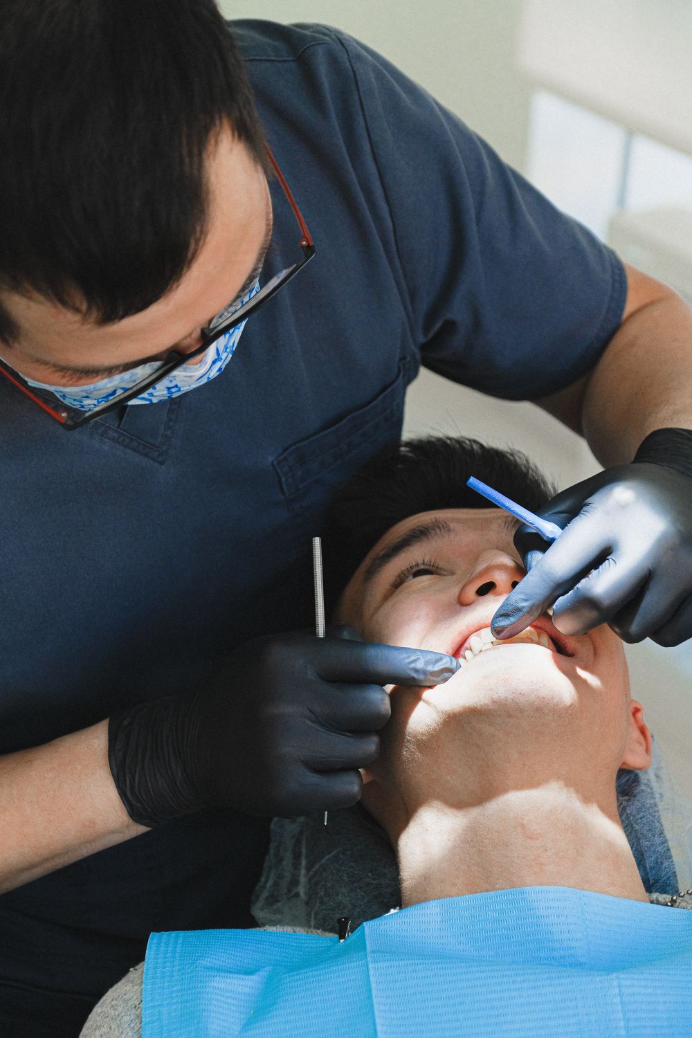 Dentist providing care in modern Tampa dental clinic