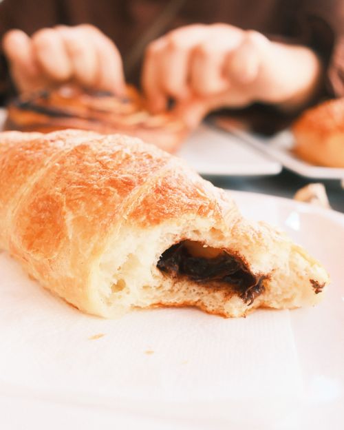 Free Close-up of a chocolate-filled croissant on a table in a Budapest cafe. Stock Photo