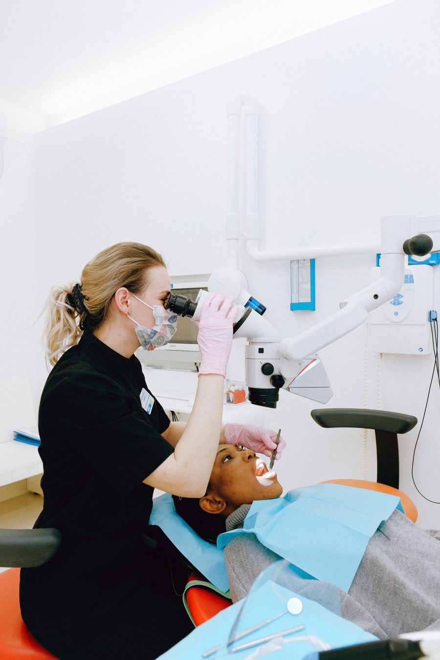 Dentist examining patient during dental check-up