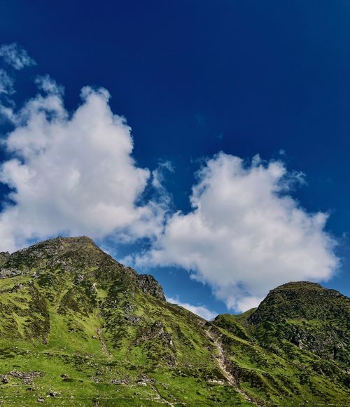 Free Beautiful green mountains under a clear blue sky in the Himalayas. Stock Photo